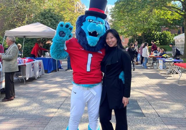 Student with mascot Duke at DUQ Day